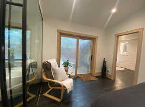 Interior space featuring finished concrete floors and vaulted ceiling