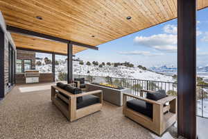 Interior space featuring area for grilling, a balcony, and a mountain view