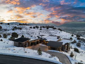 Snowy aerial view featuring a mountain view