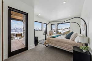 Carpeted bedroom featuring baseboards, visible vents, access to exterior, a mountain view, and recessed lighting