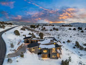 Snowy aerial view featuring a mountain view