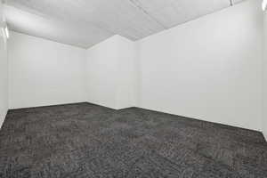 Empty room with carpet floors