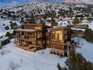 Snow covered property featuring a mountain view