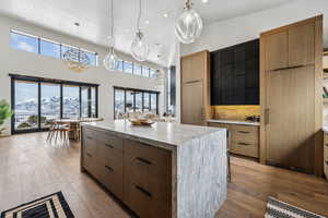 Kitchen featuring a center island, pendant lighting, a mountain view, and modern cabinets