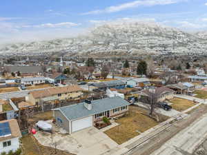 Birds eye view of property featuring a mountain view and a residential view