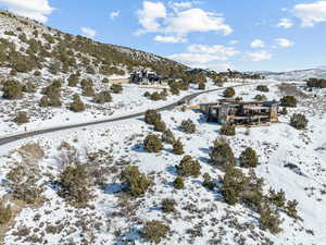 Snowy aerial view featuring a mountain view