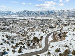 Snowy aerial view featuring a mountain view