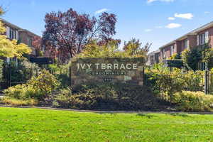 Community sign featuring a lawn