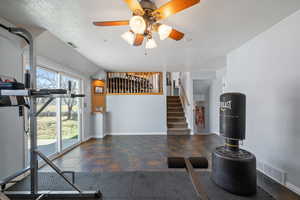 Exercise room featuring visible vents, plenty of natural light, and baseboards