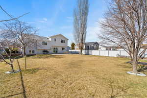 View of yard featuring a patio area and fence