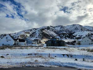 Property view of mountains with a residential view