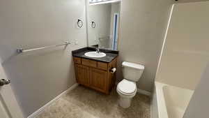 Bathroom with toilet, vanity, a shower, a bath, and tile patterned flooring