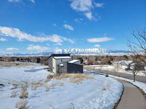 Snow covered structure featuring a mountain view