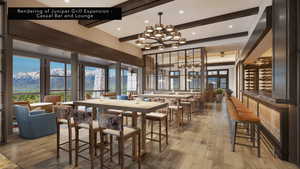 Dining room with a chandelier, light wood finished floors, beamed ceiling, and a mountain view