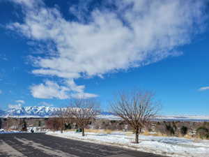 View of asphalt street with a mountain view