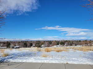 View of yard layered in snow