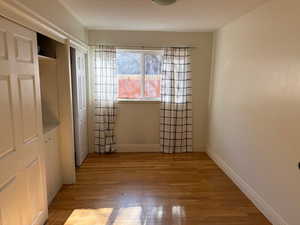 Main floor laundry with built in cabinets and ironing board