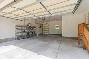 Double deep garage featuring a garage door opener