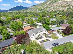 Birds eye view of property with a residential view and a mountain view