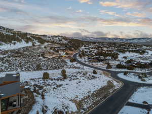 Snowy aerial view with a residential view and a mountain view