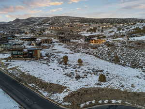 Snowy aerial view with a residential view and a mountain view