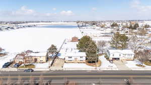 Snowy aerial view featuring a residential view