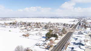 Snowy aerial view featuring a residential view