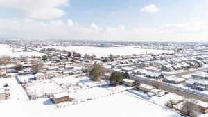 Snowy aerial view with a residential view