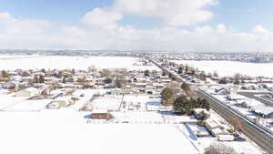 Snowy aerial view featuring a residential view