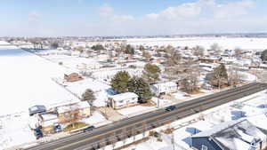 Snowy aerial view with a residential view