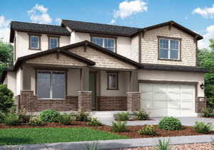 View of front of house featuring concrete driveway, brick siding, and an attached garage