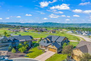 Birds eye view of property with a residential view and a mountain view