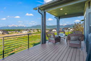 Deck with a mountain view and a residential view