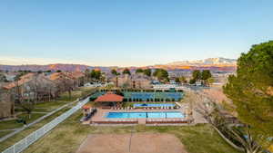 Pool with a fenced backyard, a residential view, a mountain view, and a gazebo