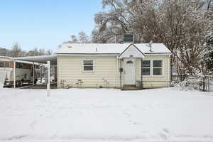 View of front of home with an attached carport