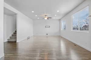 Unfurnished living room featuring visible vents, wood finished floors, and recessed lighting