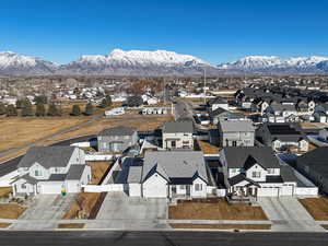 Birds eye view of property with a residential view and a mountain view