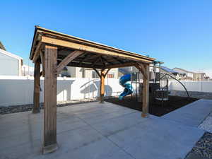 View of patio / terrace featuring a playground and a fenced backyard