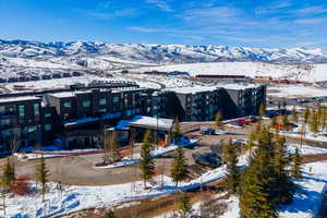 Snowy aerial view featuring a mountain view