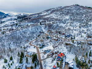 Snowy aerial view featuring a mountain view