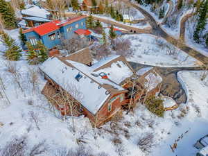 Snowy aerial view featuring a residential view