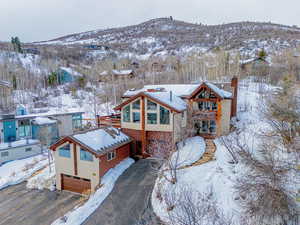 Snowy aerial view featuring a mountain view