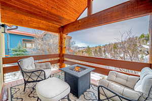 Exterior space featuring an outdoor living space with a fire pit