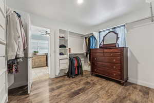 Enormous master walk in closet with convenient door to laundry