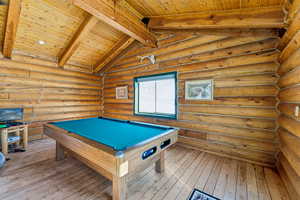 Recreation room featuring wood ceiling, pool table, vaulted ceiling with beams, and hardwood / wood-style flooring