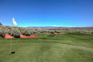 View of property's community with view of golf course and a mountain view