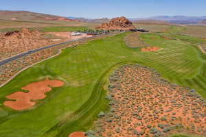 Bird's eye view with view of golf course and a mountain view