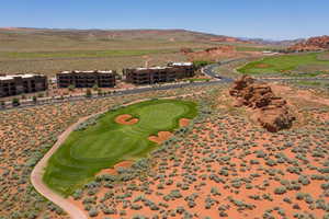 Aerial view with golf course view and a mountain view