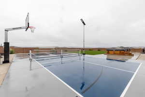 View of tennis court with fence