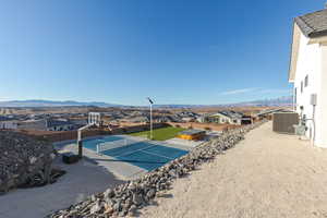 Exterior space featuring a residential view, fence, and a mountain view